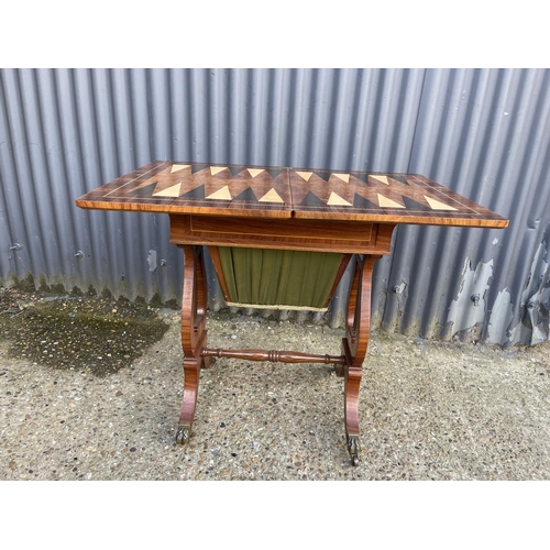 151 - A Regency mahogany fold over games table
