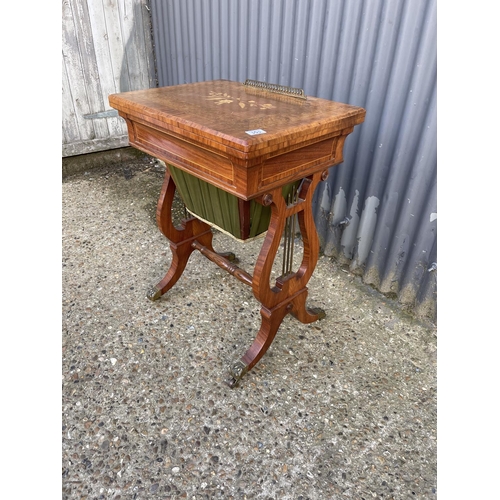 151 - A Regency mahogany fold over games table