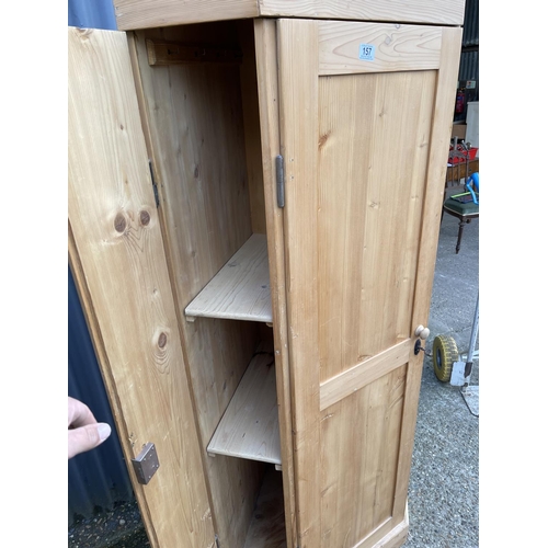 157 - A country pine corner larder cupboard with two compartments each lined with pine shelves