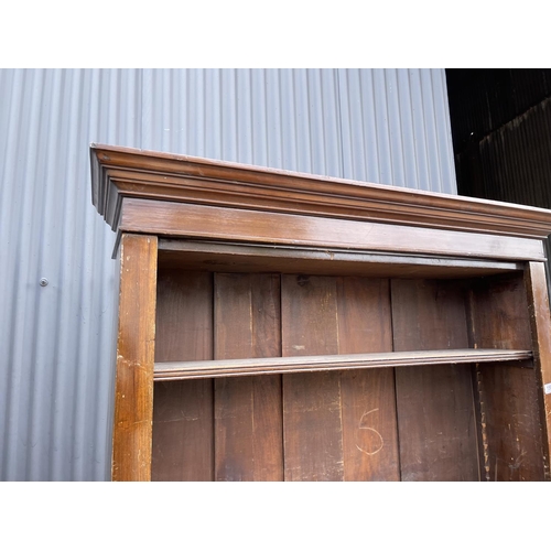 158 - An Edwardian pine open fronted bookcase with five adjustable shelves