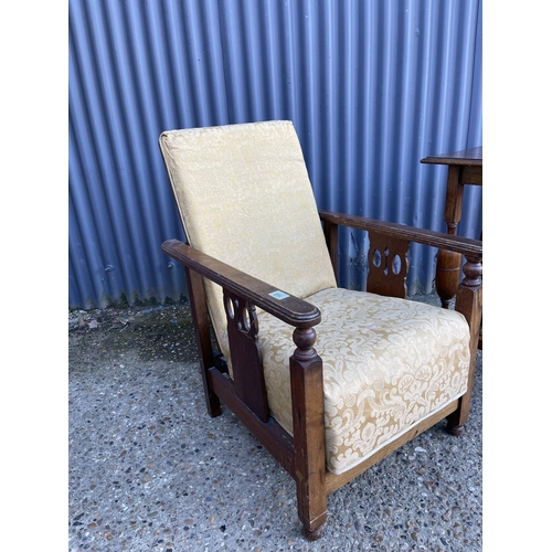 168 - A 1920's oak framed easy chair together with a oak side table