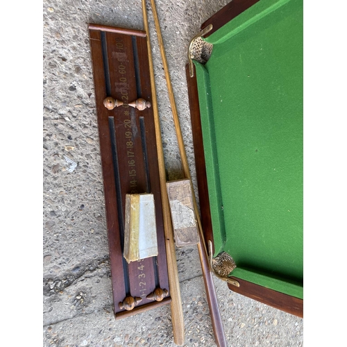 181 - A slate bed table top snooker table with cues, balls and score board 72x119