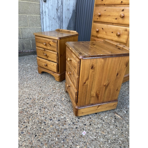 187 - A pine tallboy chest of five together with a pair of ducal pine bedside chests of three