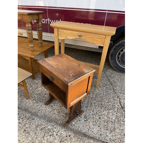 193 - A light oak hall table, three coffee tables and an oak bedside