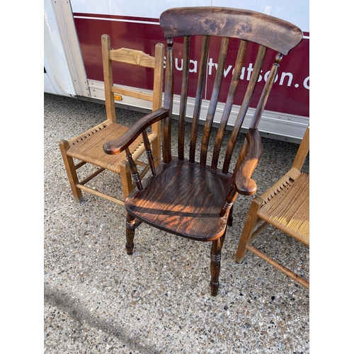 194 - A Windsor chair and two string  seat kitchen chairs