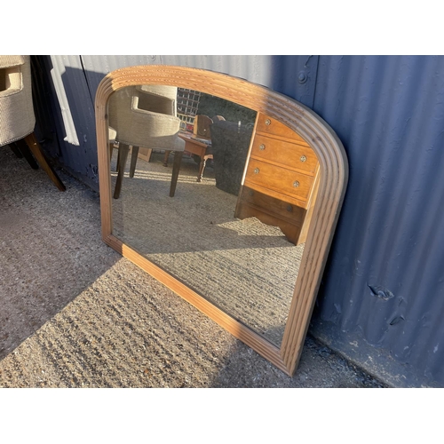 195 - A large pine overmantel mirror