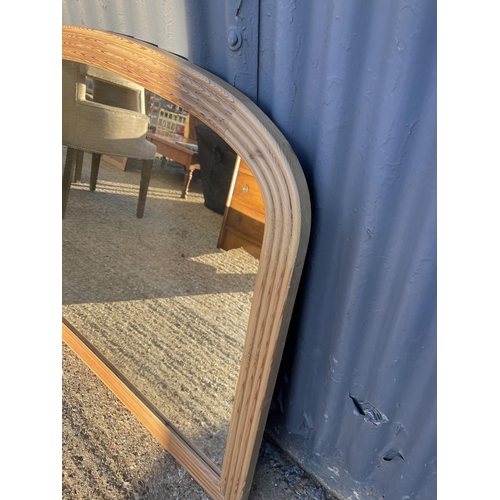 195 - A large pine overmantel mirror