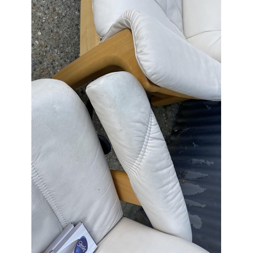 232 - A STRESSLESS cream leather three piece suite BY EKORNES consisting of a two seater sofa, two armchai... 