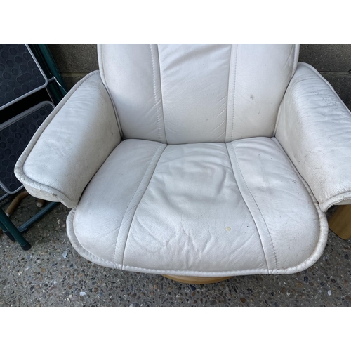 232 - A STRESSLESS cream leather three piece suite BY EKORNES consisting of a two seater sofa, two armchai... 