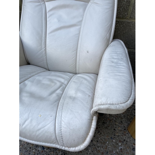 232 - A STRESSLESS cream leather three piece suite BY EKORNES consisting of a two seater sofa, two armchai... 