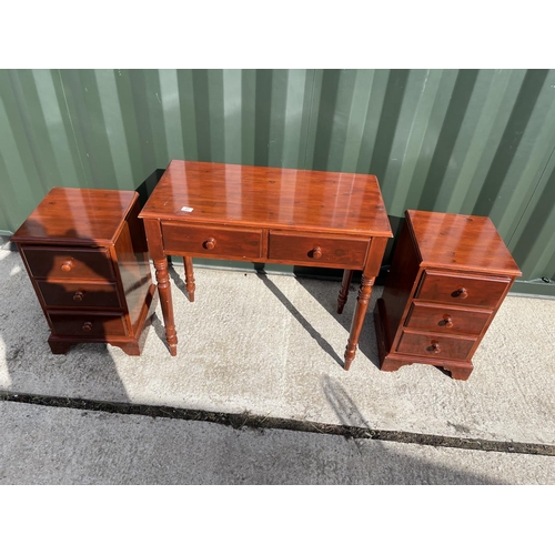 27 - A painted pine two drawer desk together with matching pair of three drawer bedsides