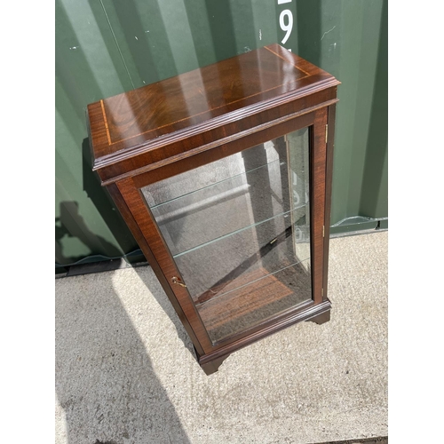 30 - A reproduction glazed mahogany cabinet