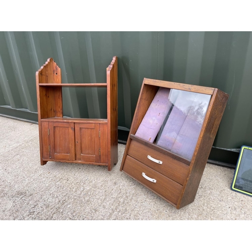 38 - An oak wall hanging medal cabinet together with a pine wall shelf