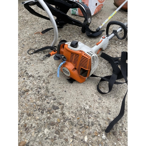 430 - A stihl km 56 RC multitool hedge cutter / strimmer and harness