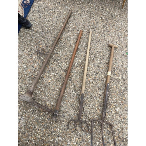 431 - Four vintage garden hand tools