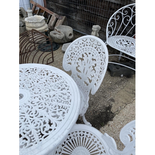 443 - A circular white painted aluminium garden table with four chairs