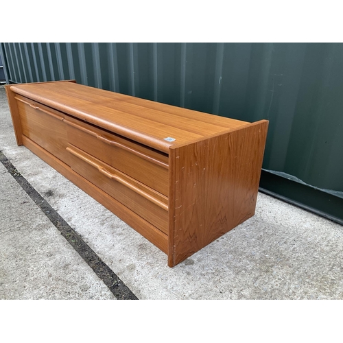 55 - A mid century low teak sideboard / media stand