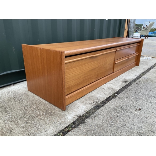 55 - A mid century low teak sideboard / media stand