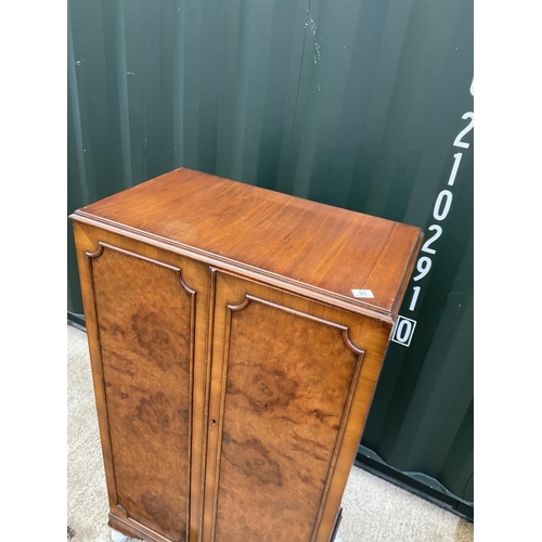 59 - A gentleman's walnut tallboy cupboard