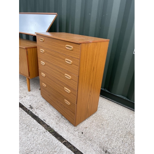 8 - A mid century teak effect bedroom pair consisting of a tallboy chest of five and a dressing chest