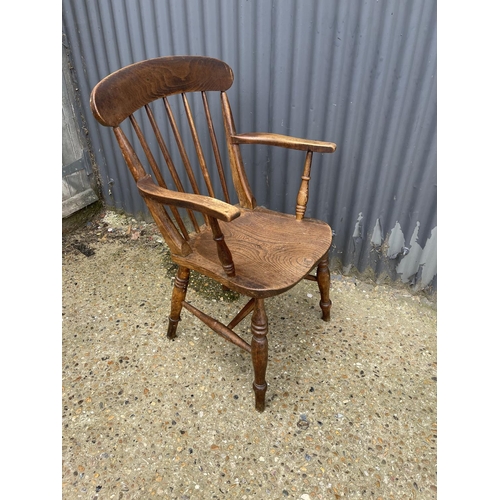 82 - A stick back Windsor carver chair