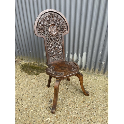 84 - A carved oak hall chair