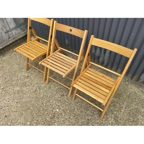 85 - Three folding chairs