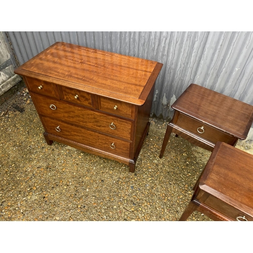 89 - A stag chest of five together with a pair of bedsides