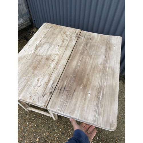 91 - A country pine farmhouse table with drop leaf