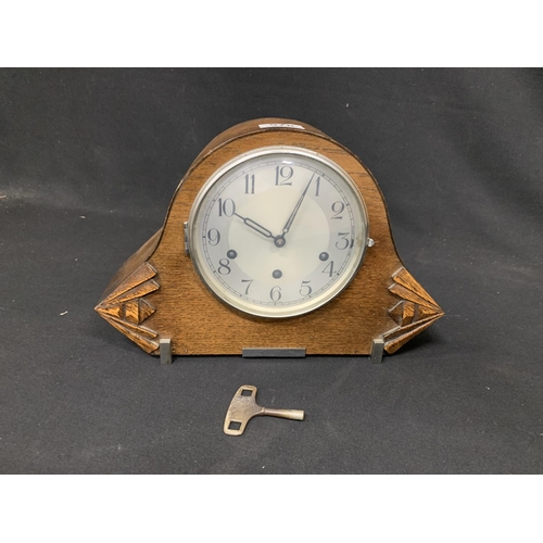 578 - Oak mantel clock with key and pendulum