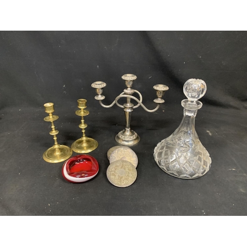 672 - Cut glass Decanter, plated candelabra  and coasters, pair brass candle sticks and glass ashtray