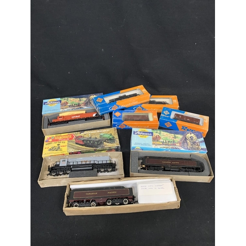 790 - Three boxed HO gauge locos, and four wagons