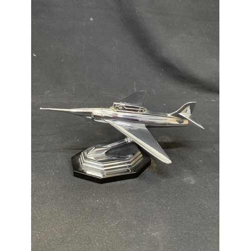 975 - Vintage chrome fighter jet plane novelty table lighter on swivel base, length 23 cms