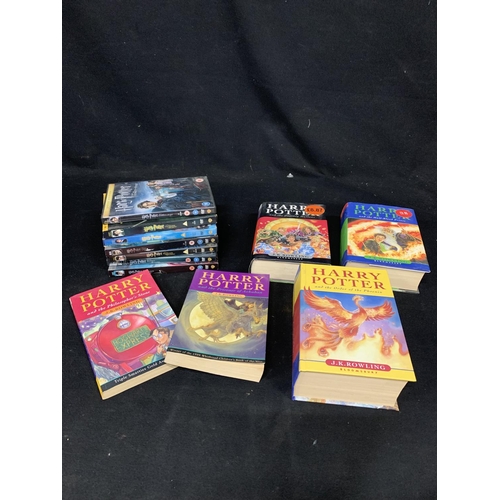 989 - Three hardbacked First Edition Harry Potter Books, two paperbacks and DVD's