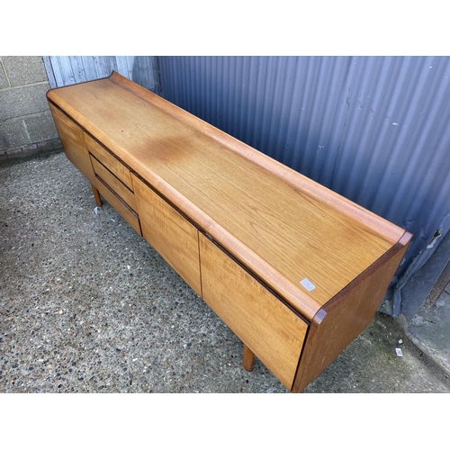 1 - A mid century teak cocktail sideboard by White and newton