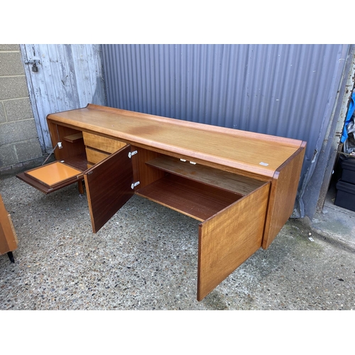 1 - A mid century teak cocktail sideboard by White and newton