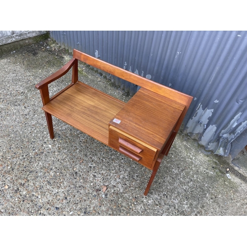 107 - A mid century teak telephone seat by Chippy Heath with yellow cushion seat