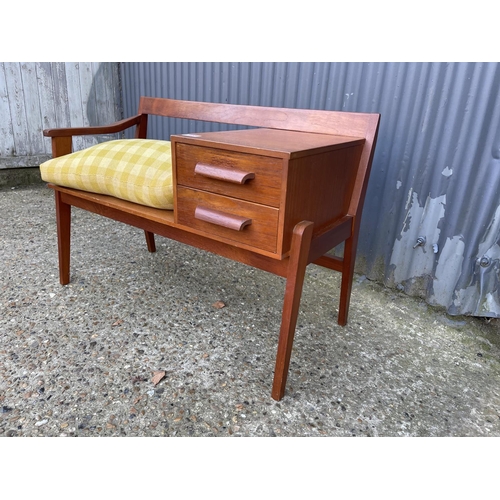 107 - A mid century teak telephone seat by Chippy Heath with yellow cushion seat