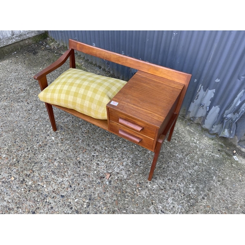 107 - A mid century teak telephone seat by Chippy Heath with yellow cushion seat