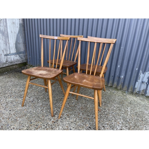 108 - A set of four ercol stick back kitchen chairs