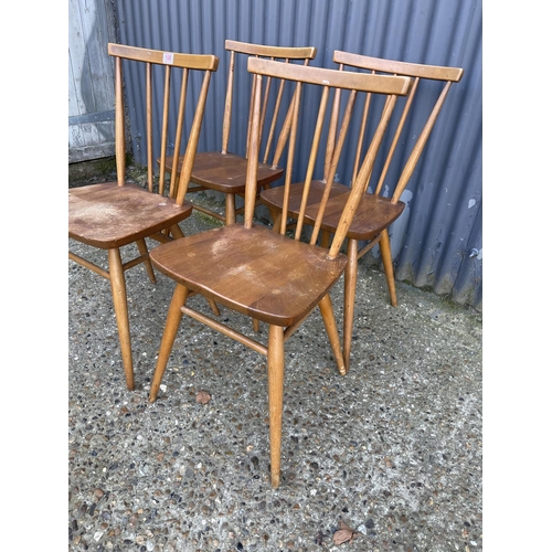 108 - A set of four ercol stick back kitchen chairs