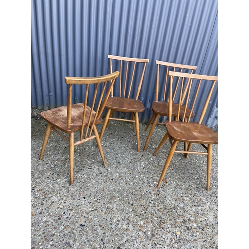 108 - A set of four ercol stick back kitchen chairs