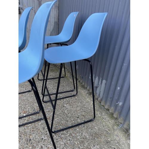 110 - A set of four modern metal framed bar stools with blue plastic seats