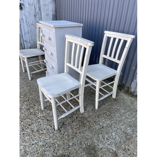 14 - A grey painted pine chest of four together with a set of four painted chairs