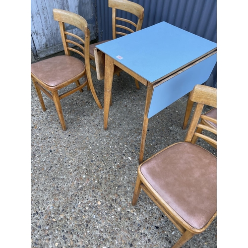 140 - Vintage formica kitchen table and four chairs