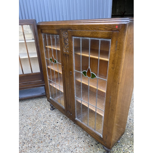 141 - Two early 20th century oak display cabinets