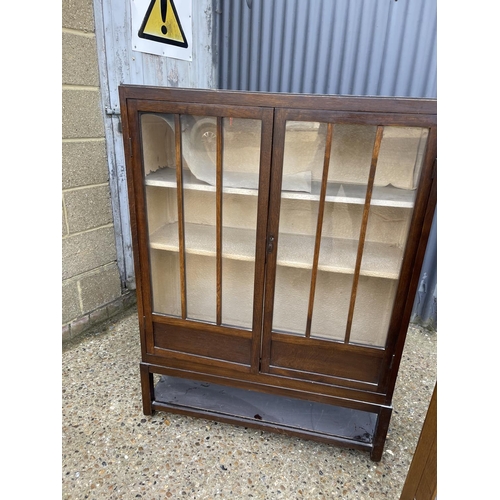 141 - Two early 20th century oak display cabinets