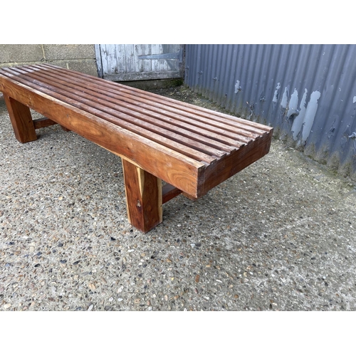 156 - An Indonesian fruitwood bench seat 180cm wide