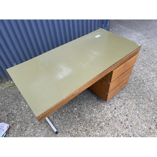 169 - A mid century teak and metal framed desk