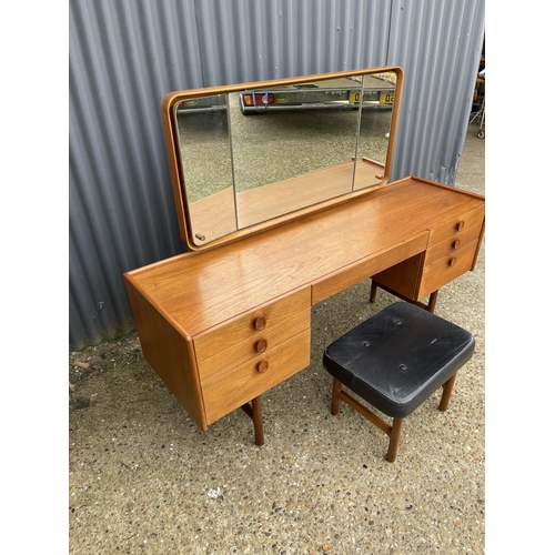 173 - A teak six drawer dressing table by MEREDEW with stool